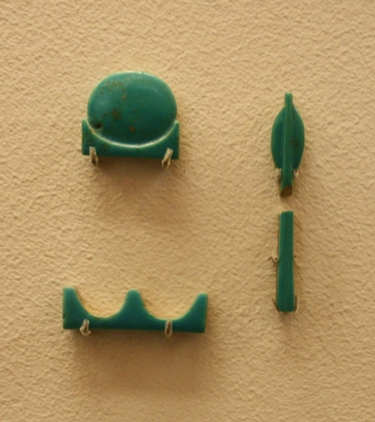 Three inlay fayence hieroglyphs; Paris, Louvre Museum
